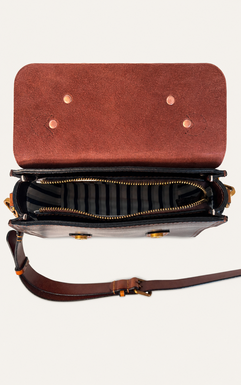 Wide leather flap and secure zipper opening on The Cypress satchel